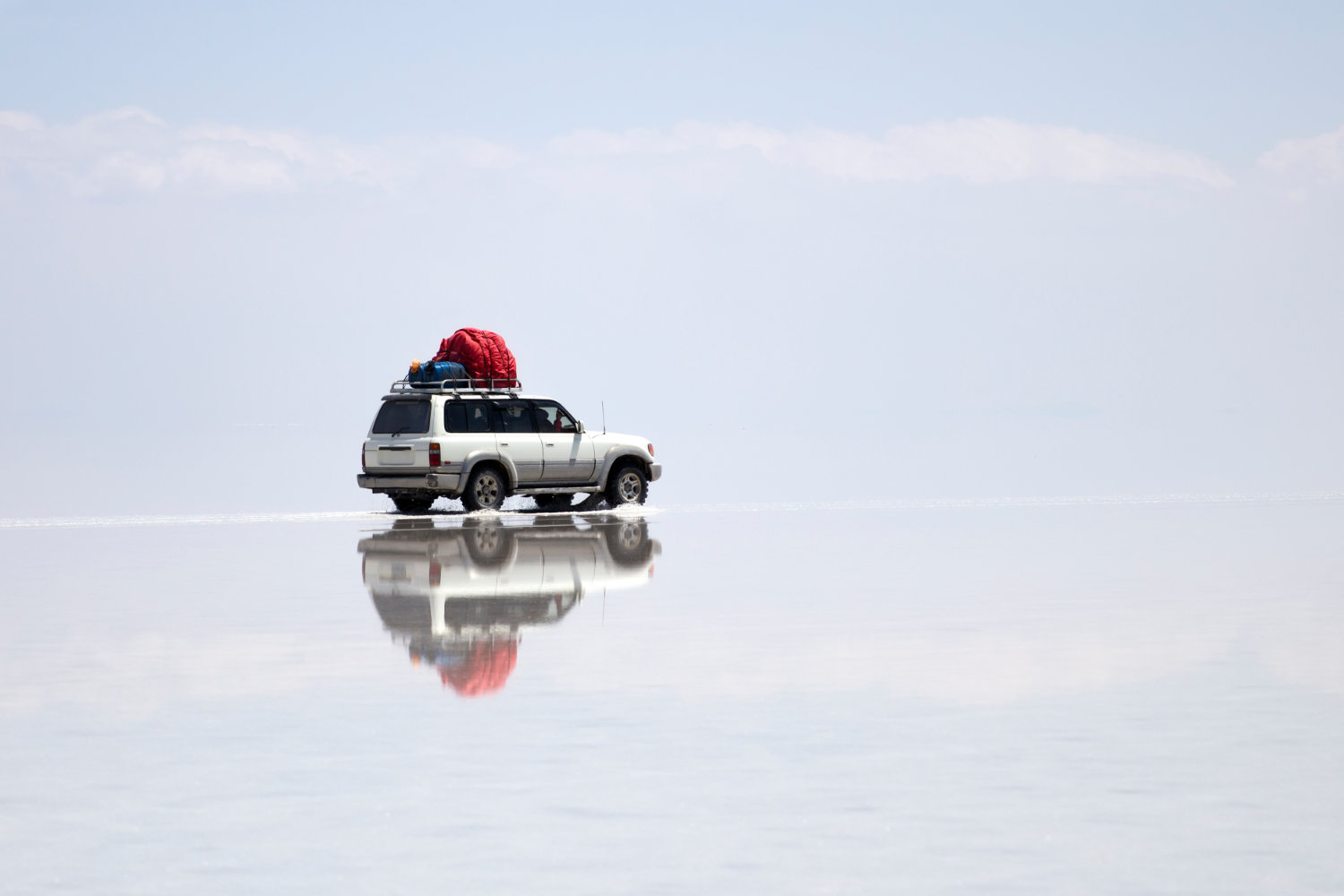 Terrain vehicle at Salar de uyuni salt flat in Bolivia